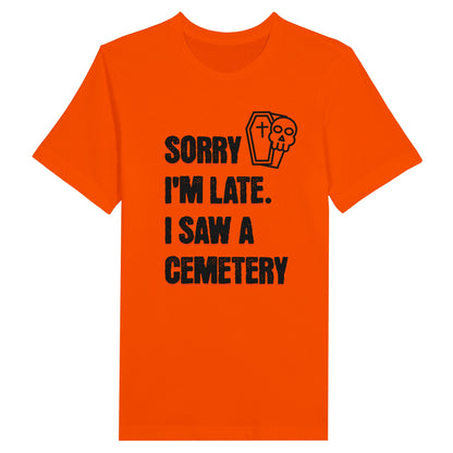 Bella Canvas 3001 T-Shirt with  the words Sorry I'm Late. I Saw A Cemetery in black and a small skull and coffin graphic to the top right of the text. Shirt is athletic orange