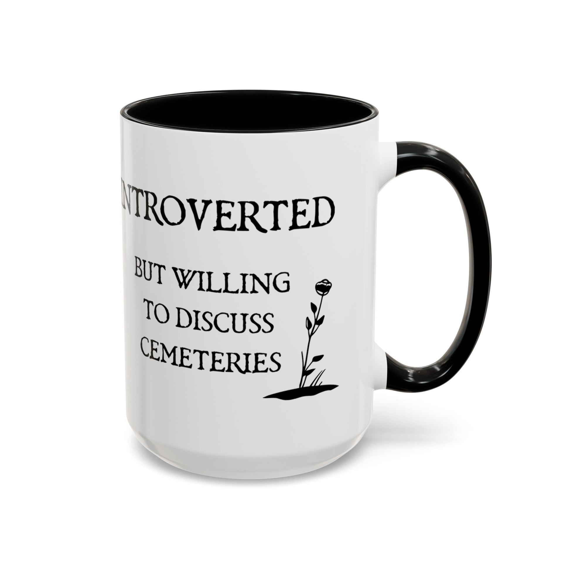 15 oz white ceramic mug with black text and graphics and  a black handle and black interior. One side says Introverted but willing to discuss cemeteries the other side has a tombstone with a skull on it