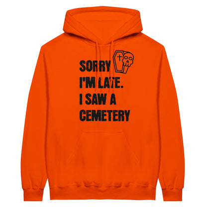 Gildan 18500 Hoodie Sweatshirt with the words Sorry I'm Late. I Saw A Cemetery in black and a small skull and coffin graphic to the top right of the text. Hoodie is orange