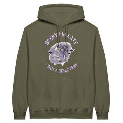 Gildan 18500 Hoodie Sweatshirt with the words Sorry Im Late I saw a cemetery around a graphic of a cemetery.  Colors of the graphic are purple and grey. Hoodie is military green